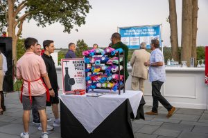 Outdoor wine pull booth with colorful rolled towels