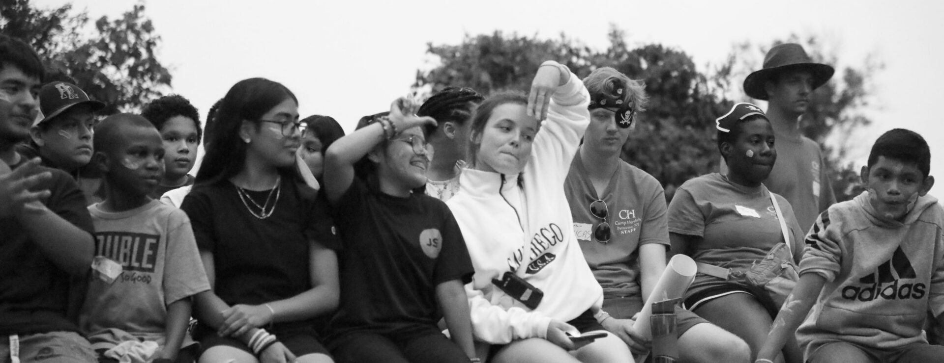 Diverse group of children sitting outdoors