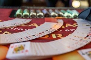 Fanned playing cards on casino table with chips