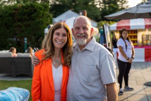 Smiling couple posing at outdoor fair