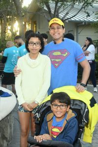 Father with two children, son in Superman shirt