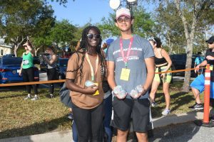 Two young runners with medals at finish line