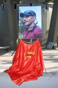 Red Superman cape on stage before portrait