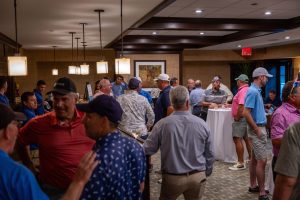 Men mingling in hotel lounge